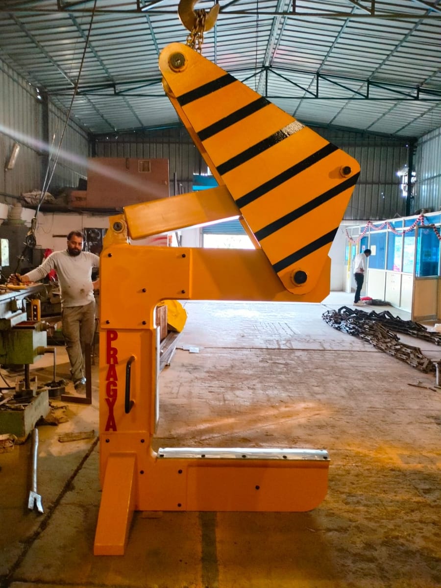 Spring C hook hanging from the works crane, seen side on through the open throat