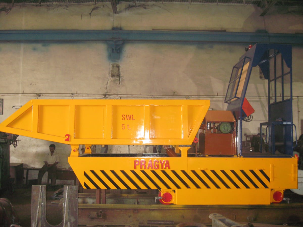 Hydraulic Tipper Trolley - Motorised trolley with hydraulic tilting mechanism for efficient coil handling